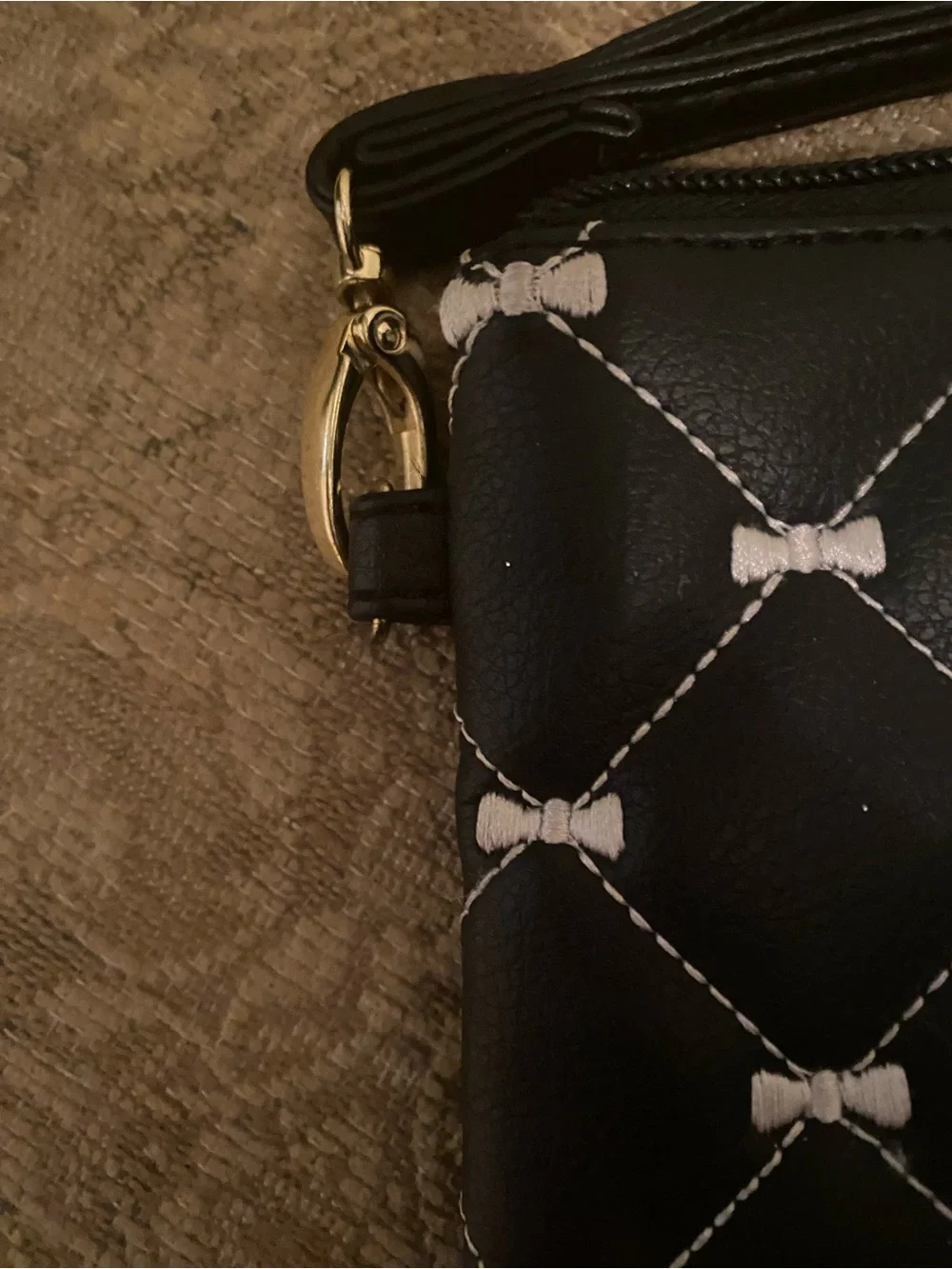 Betsey Johnson Black Quilted Bow-Print Wristlet with Gold Plaque
